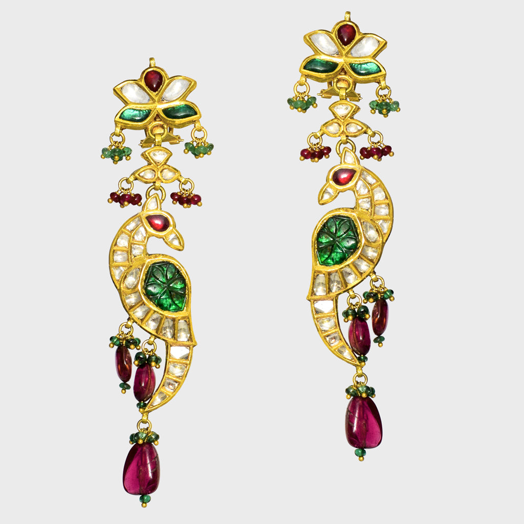 Peacock-inspired stunning long earring pair. Adorned with shimmering diamond polki and vibrant colored stones,(KME2090)