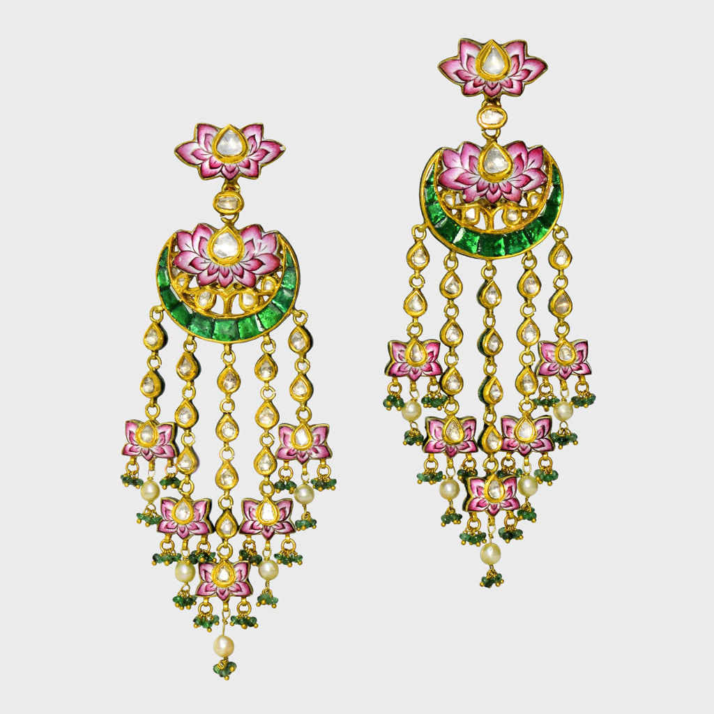 Experience the epitome of elegance with our exquisite long earrings, adorned with delicate pink enameled work, shimmering uncut diamonds, and vibrant green stones. Complete with dangling emerald beads and pearls (KME2182)