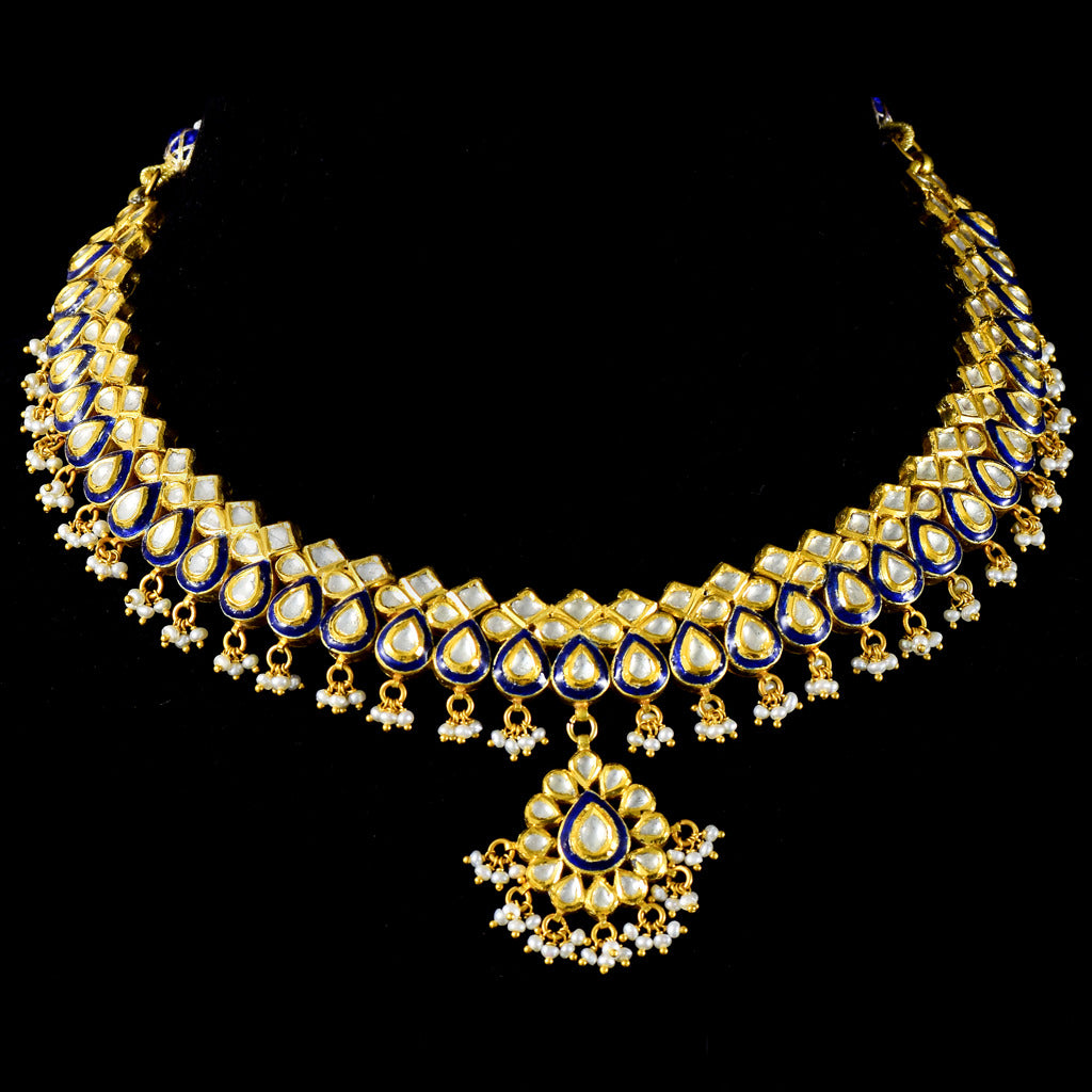 Blue Meena necklace set, intricately adorned with gleaming diamond polki and lustrous pearls. A fusion of tradition and sophistication.(KMNE3378)