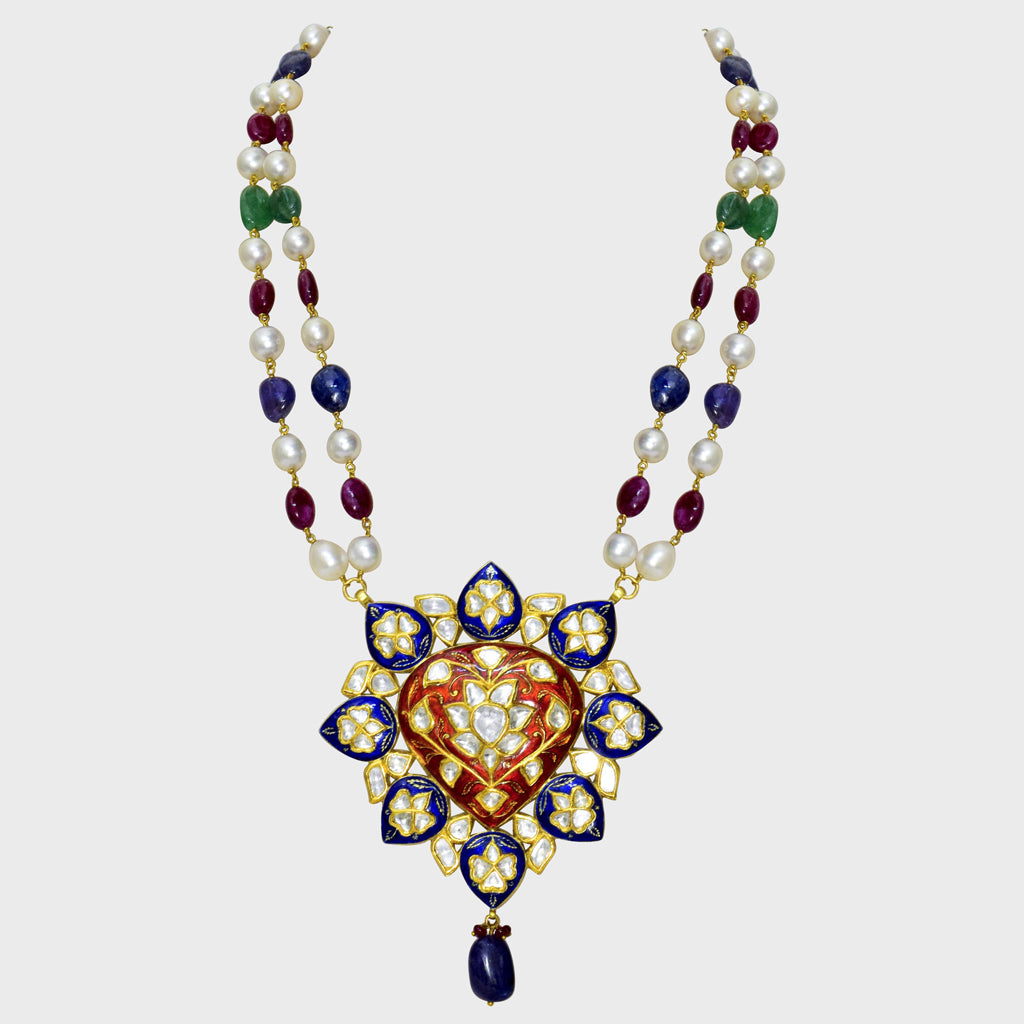 Red and blue Meena big pendant, adorned with dazzling diamond polki, strung alongside the rich hues of emerald, ruby, sapphire, and the lustrous elegance of South Sea pearls.(KMNE3406)